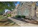 Stunning home with stone accents, manicured landscaping, and a welcoming sidewalk leading to the entrance at 4731 Moon Chase Dr, Buford, GA 30519