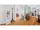Bright hallway with hardwood floors and stylish decor, leading to the living areas and bedrooms at 4731 Moon Chase Dr, Buford, GA 30519