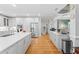 Modern kitchen features white cabinets, stainless steel appliances, and a spacious layout at 4731 Moon Chase Dr, Buford, GA 30519