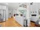 View of kitchen and open floor plan featuring modern design and stainless appliances at 4731 Moon Chase Dr, Buford, GA 30519