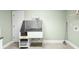 Laundry room with pet washing station, shelving and a neutral paint color at 4731 Moon Chase Dr, Buford, GA 30519