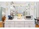 Open-concept living room features soaring ceilings, fireplace and kitchen with stainless steel appliances and granite counters at 4731 Moon Chase Dr, Buford, GA 30519