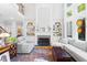 Open-concept living room featuring a fireplace, built-in bookshelves, and lots of natural light at 4731 Moon Chase Dr, Buford, GA 30519