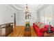 Cozy living room with hardwood floors, elegant decor, and plenty of natural light, perfect for relaxation at 4731 Moon Chase Dr, Buford, GA 30519