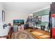 Bright home office with hardwood floors, large desk, and ample storage space, perfect for remote work at 4731 Moon Chase Dr, Buford, GA 30519