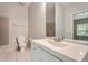 Clean bathroom features a vanity, toilet, and tiled shower, with neutral gray paint at 558 Elbridge Nw Dr, Atlanta, GA 30318