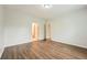 Comfortable bedroom showing neutral walls, hardwood floors, and doorways to other rooms at 558 Elbridge Nw Dr, Atlanta, GA 30318