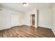 Spacious bedroom features wood-look floors, ample closet space, and a neutral color palette at 558 Elbridge Nw Dr, Atlanta, GA 30318