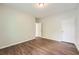 Cozy bedroom showing wood floors, a closet, and a doorway leading to another room at 558 Elbridge Nw Dr, Atlanta, GA 30318
