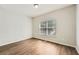 Inviting bedroom with light-filled window, plank flooring and a neutral color scheme at 558 Elbridge Nw Dr, Atlanta, GA 30318