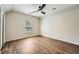The light-filled bedroom features wood-look floors and a bright window at 558 Elbridge Nw Dr, Atlanta, GA 30318