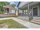 Charming gray house with a covered front porch and well-maintained landscaping at 558 Elbridge Nw Dr, Atlanta, GA 30318