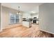 Bright kitchen featuring white cabinets, breakfast bar, modern appliances, and natural light from the adjacent dining area at 558 Elbridge Nw Dr, Atlanta, GA 30318
