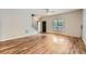 Bright living room with hardwood floors, staircase, and natural light pouring through a window, creating an inviting space at 558 Elbridge Nw Dr, Atlanta, GA 30318