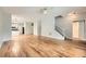 Spacious living area with hardwood floors leading to a well-lit kitchen and staircase, creating a seamless flow throughout at 558 Elbridge Nw Dr, Atlanta, GA 30318