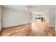 Inviting living room with gleaming hardwood floors seamlessly connecting to the modern kitchen at 558 Elbridge Nw Dr, Atlanta, GA 30318