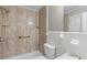 Bathroom featuring a shower, tiled walls, and modern fixtures at 6459 Paula Ct, Rex, GA 30273