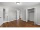 Bedroom with hardwood floors, closet, and access to an ensuite bathroom at 6459 Paula Ct, Rex, GA 30273