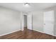 Bedroom with hardwood floors and view to bathroom at 6459 Paula Ct, Rex, GA 30273