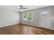 Inviting living room with gleaming hardwood floors, ceiling fan, and natural light at 6459 Paula Ct, Rex, GA 30273