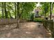 Community dog park features a walking path and a bench, surrounded by trees at 791 Wylie Se St # 911, Atlanta, GA 30316