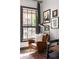 Bright office nook with gallery wall, natural light, and comfortable chair at 791 Wylie Se St # 911, Atlanta, GA 30316