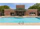 Community pool and hot tub with shallow area, surrounded by an elegant brick clubhouse at 791 Wylie Se St # 911, Atlanta, GA 30316