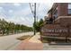 Street view of Mill Town Lofts with brick sign and mural lined street at 791 Wylie Se St # 911, Atlanta, GA 30316