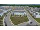 Beautifully designed townhome community with well-maintained landscaping and a central green space at 1117 Larkin Dr, Buford, GA 30518