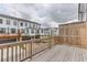 Spacious wooden deck with railing offering views of neighboring homes and garages at 1117 Larkin Dr, Buford, GA 30518
