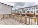 Inviting backyard decks with wood railings overlooking street view and neighboring garages at 1117 Larkin Dr, Buford, GA 30518
