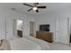Bedroom featuring an ensuite bathroom, a television, and neutral decor at 1117 Larkin Dr, Buford, GA 30518