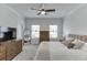 Bedroom featuring a neutral color palette, large bed, dresser, and two windows at 1117 Larkin Dr, Buford, GA 30518