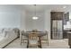 Dining Area features a round table with seating for four, adjacent to the modern kitchen at 1117 Larkin Dr, Buford, GA 30518