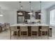 Modern kitchen featuring a large island with seating and stylish pendant lighting at 1117 Larkin Dr, Buford, GA 30518