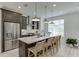 Modern kitchen features stainless steel appliances, a large island, pendant lighting, and ample counter space at 1117 Larkin Dr, Buford, GA 30518