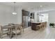 A modern kitchen with stainless steel appliances and a large island at 1117 Larkin Dr, Buford, GA 30518