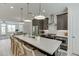 Open-concept kitchen with large island, stainless steel appliances, and barstool seating at 1117 Larkin Dr, Buford, GA 30518