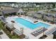 Gorgeous community pool area with ample lounge chairs, covered outdoor seating, and meticulously kept surroundings at 1117 Larkin Dr, Buford, GA 30518
