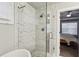 Luxurious glass shower featuring floor to ceiling tile adjacent to the bedroom at 2023 Yellow Finch Trl, Atlanta, GA 30316