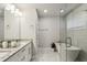 Elegant bathroom featuring a double vanity, a freestanding tub, and marble flooring at 2023 Yellow Finch Trl, Atlanta, GA 30316