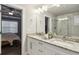Elegant bathroom featuring granite countertops, double sinks, and a glass-enclosed shower at 2023 Yellow Finch Trl, Atlanta, GA 30316