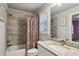 Bathroom with stone tile shower and granite countertop at 2023 Yellow Finch Trl, Atlanta, GA 30316