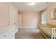 Pink Bedroom with gray carpet and white furniture at 2023 Yellow Finch Trl, Atlanta, GA 30316