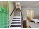 Welcoming foyer featuring hardwood floors, a staircase, and an open view to the living area at 2023 Yellow Finch Trl, Atlanta, GA 30316