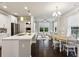 Open-concept kitchen featuring an island, stainless steel appliances, and seamless flow into the living area at 2023 Yellow Finch Trl, Atlanta, GA 30316