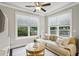 Bright living room featuring a plush sectional sofa, a large window, and a stylish coffee table at 2023 Yellow Finch Trl, Atlanta, GA 30316