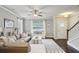 Bright living room with large window, ceiling fan, comfortable sofa, and stylish décor enhancing the space at 2023 Yellow Finch Trl, Atlanta, GA 30316