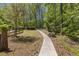 A stone path leads through a meticulously manicured yard with trees at 2377 Pine Mountain Rd, Kennesaw, GA 30152