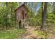 Backyard featuring a wooden treehouse surrounded by trees at 2377 Pine Mountain Rd, Kennesaw, GA 30152